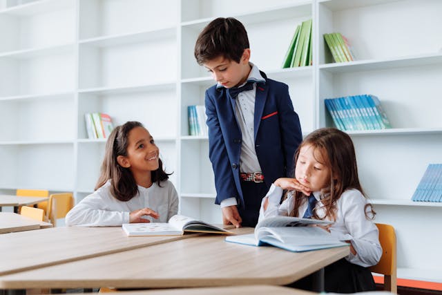 Children reading books in a library